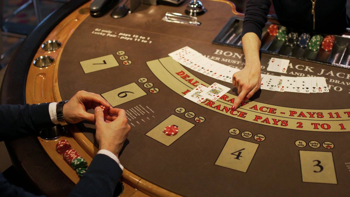 Blackjack table from above: chips and dealt cards